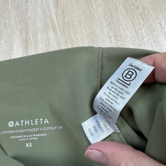 Athleta Salutation Stash Pocket II Laser Cut 7/8 Tight Olive Green Leggings XS - Picture 11 of 16